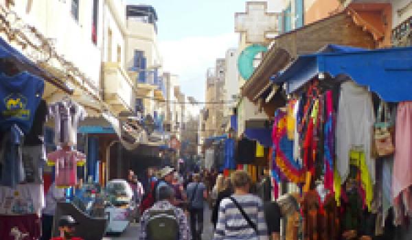 Visitors exploring the colorful medina in Essaouira. Photo by Randy Keck