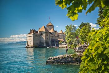 Find the dank prison and battle-scarred weapons at Chateau de Chillon before strolling the ramparts for a tingly view of Lake Geneva.