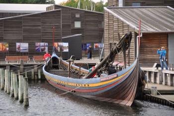 In Denmark, visitors can view replica Viking ships in Roskilde’s harbor — and even row and sail a reconstructed ship around the fjord.
