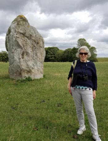 Edna R.S. Alvarez in front of one of the stones at Avebury.