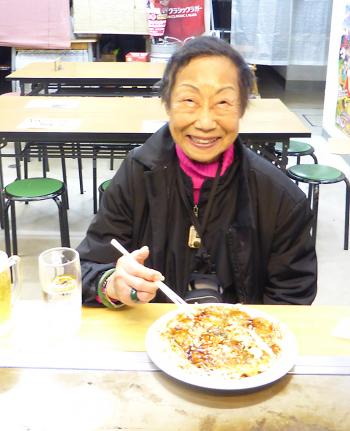 Dorothy Chang Van Horn enjoying okonomiyaki in Osaka, Japan.