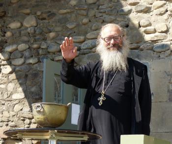 A priest offers a blessing outside Svetitskhoveli Cathedral in Mtskheta.