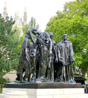 Rodin’s “The Burghers of Calais,” with a south tower of the Palace of Westminster (which houses Parliament) visible in the background — London.