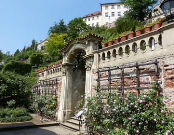 An archway, bordered by roses, leads to a series of Greater Fürstenberg terraced gardens.