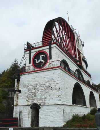 The world’ s largest working waterwheel, the Laxey Wheel, displays the official emblem of the Isle of Man, the Three Legs of Man. Photo by Dorene Clement