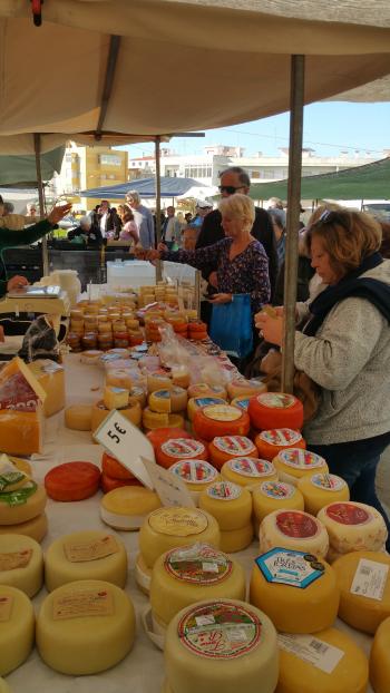 Cheese booth at the Quarteira weekly market — the Algarve, Portugal.