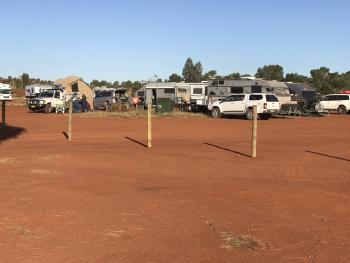 The campground at Ayers Rock attracts all sorts of Outback travel rigs.