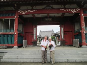 Simon and Anne Lowings at an entrance to a temple in Japan.