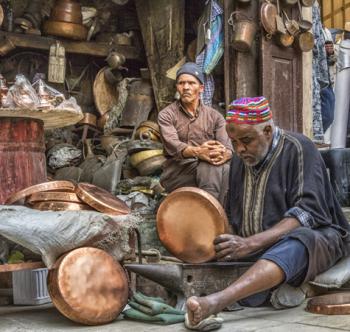 A coppersmith at work in the medina in Fes.