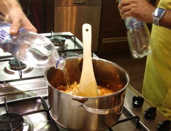 Adding water to the simmering Hungarian Goulash. Photos by Sandra Scott