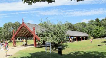 Wooden boathouse with Māori carvings at Waitangi — North Island, New Zealand.