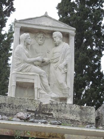 Memorial with the deceased bidding farewell to a relative or friend – Kerameikos Archaeological Park, Athens.