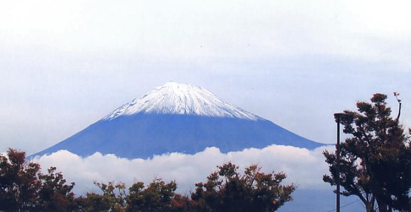 The nearly symmetrical cone of Japan’s Mt. Fuji towers over the clouds.