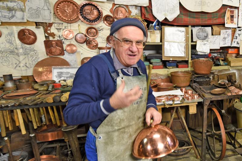 A coppersmith in Montepulciano, Italy. Photo by Cameron Hewitt